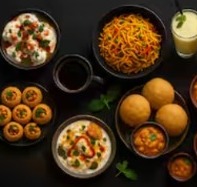 A spread of Ruva chaat, pani puri, noodles and drinks